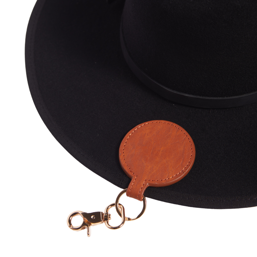 Discover the Brown Magnetic Leather Clip Hat Holder, a smart and stylish accessory to keep your hats secure. Designed with a magnetic closure, this holder ensures your hats stay in place while adding a touch of sophistication with its rich brown leather finish. A must-have for hat enthusiasts, this accessory combines practicality with a timeless design.