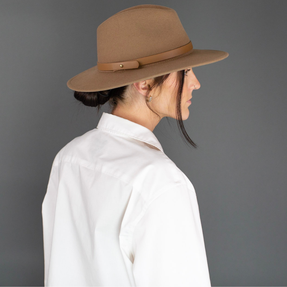 Introducing the Brown Wide Brim Fedora with Leather Band, a timeless symbol of sophistication and style. This classic fedora features a broad brim elegantly accented with a rich brown leather band. A versatile and refined accessory, it adds a touch of class to your attire, making it perfect for any occasion where you want to make a statement.