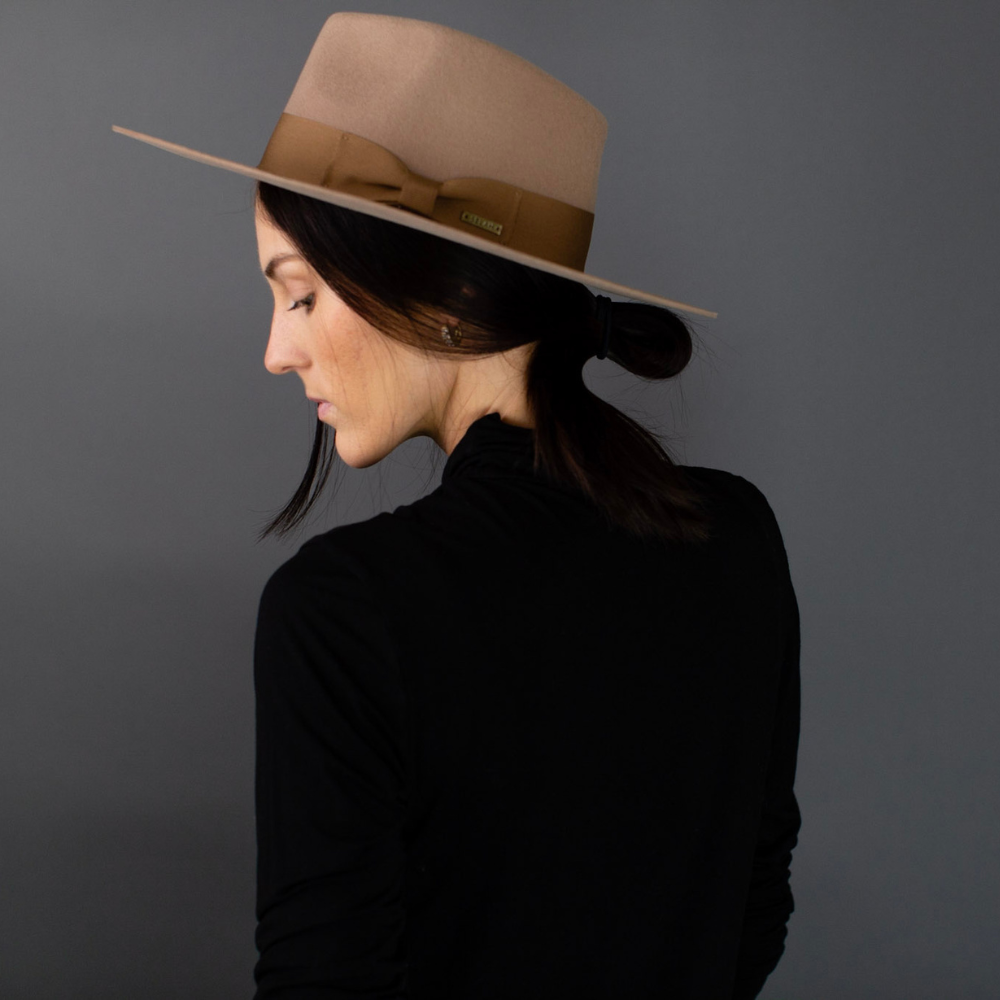 Presenting the Brown Wide Brim Fedora with Band, a symbol of timeless sophistication. This classic fedora showcases a wide brim and a tasteful band, effortlessly blending traditional charm with contemporary style. An essential accessory that exudes refinement, it's the perfect choice to elevate your fashion game for any occasion.